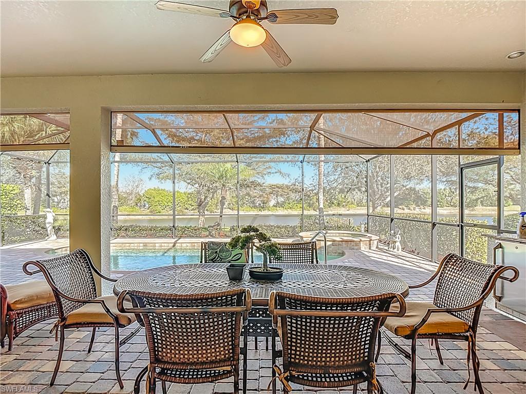 9250 Veneto Place Naples, FL 34113 - Photo 44 of 50 a view of a dining room with furniture window and outside view