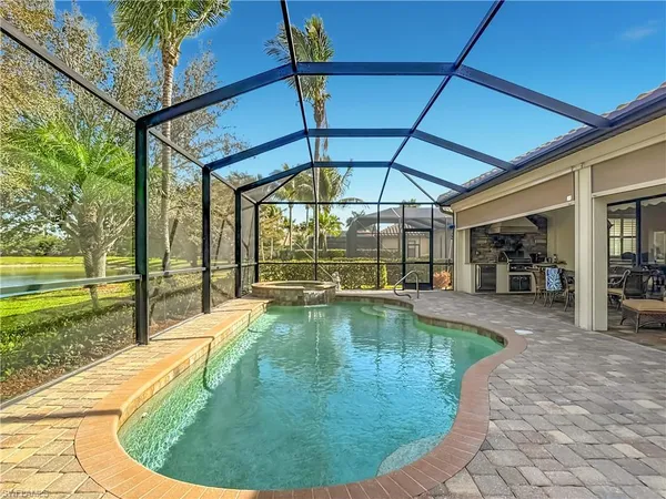 a swimming pool with outdoor seating