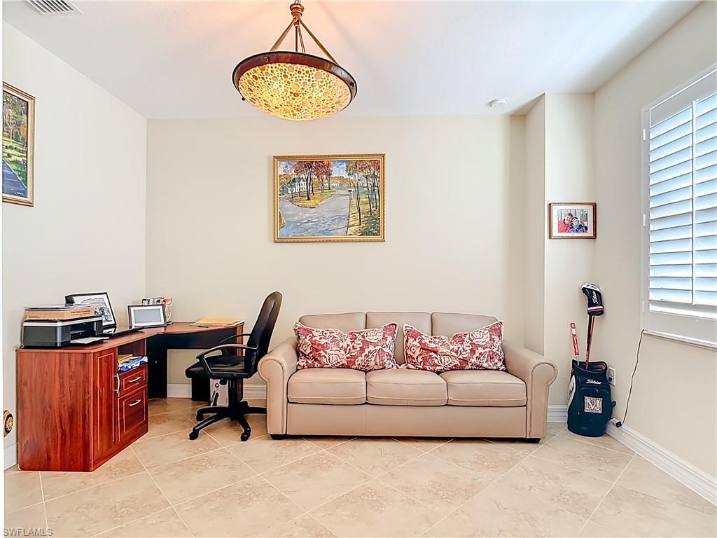 9250 Veneto Place Naples, FL 34113 - Photo 5 of 50 a living room with furniture