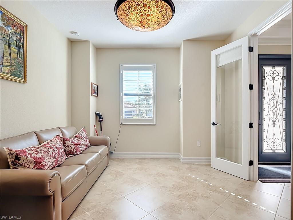 9250 Veneto Place Naples, FL 34113 - Photo 6 of 50 a living room with furniture and a window