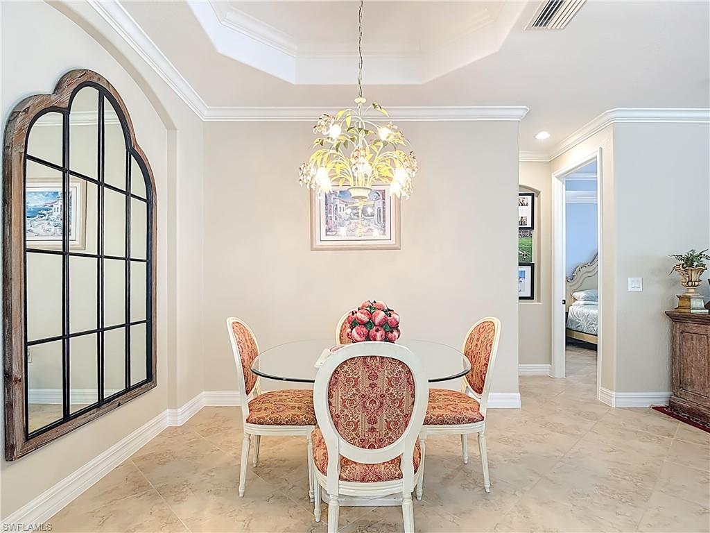 9250 Veneto Place Naples, FL 34113 - Photo 7 of 50 a view of a dining room with furniture window and outside view