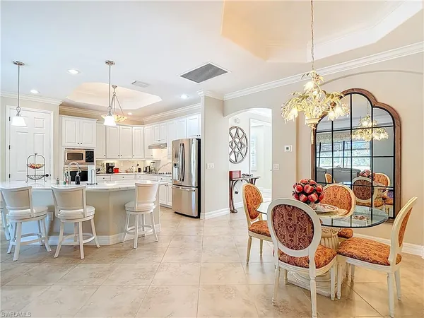 a dinning table and chairs in a room