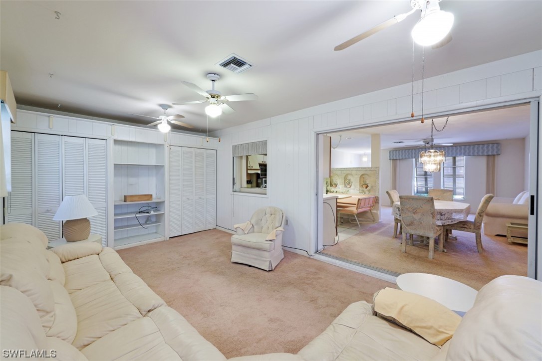 17421 Delaware Road Fort Myers, FL 33967 - Photo 8 of 25 a living room with furniture and a chandelier