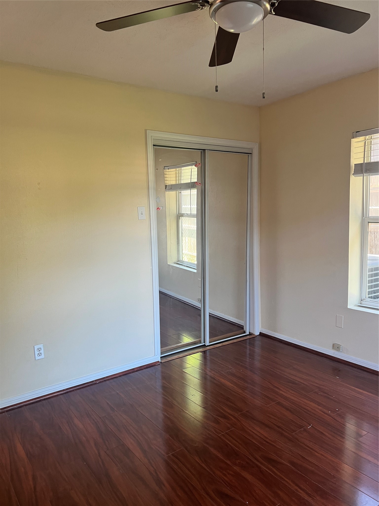 5604 Chapman Street Houston, TX 77009 - Photo 16 of 25 a view of an empty room with wooden floor and a window