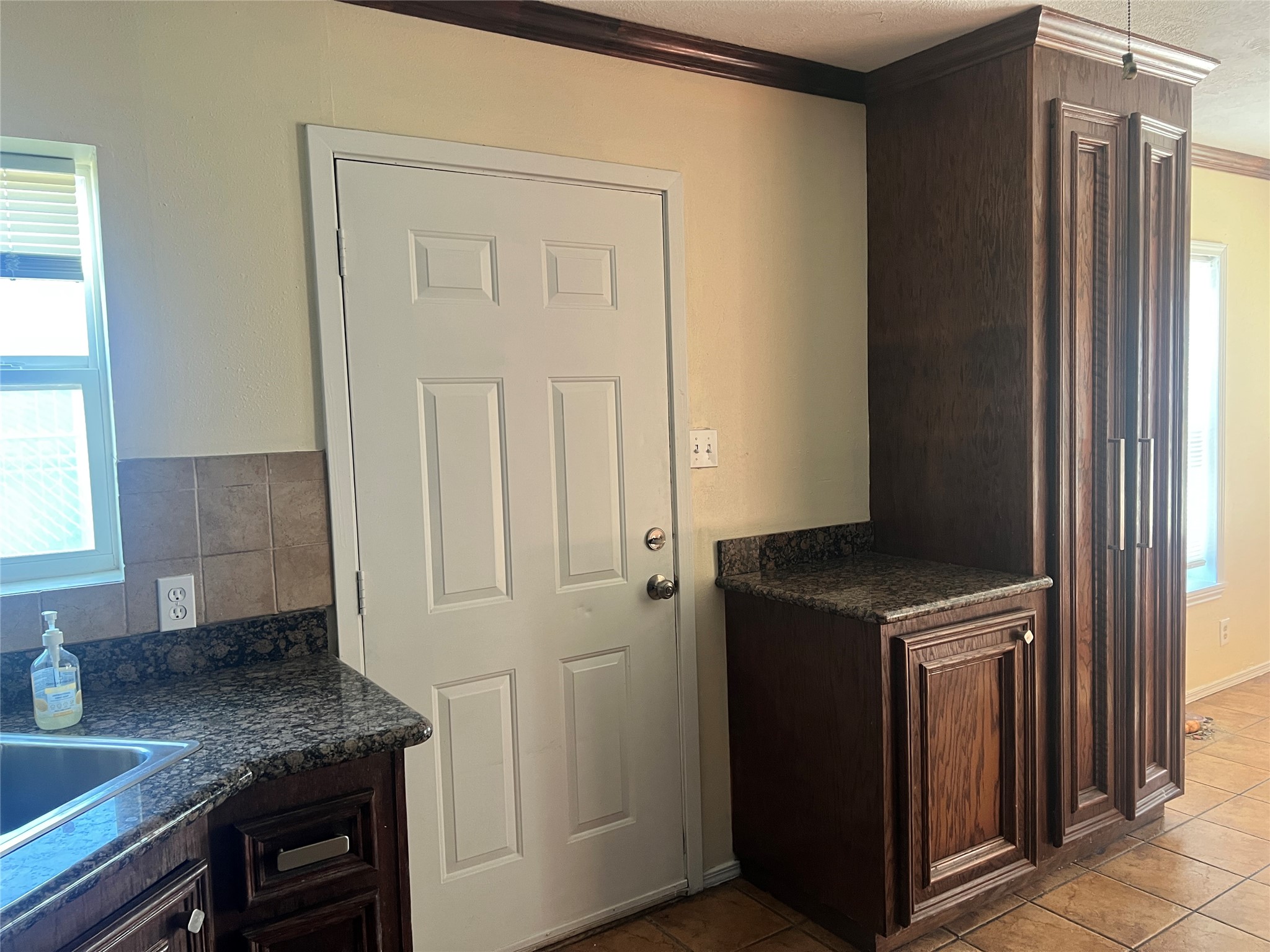 5604 Chapman Street Houston, TX 77009 - Photo 8 of 25 a kitchen with a refrigerator and cabinets