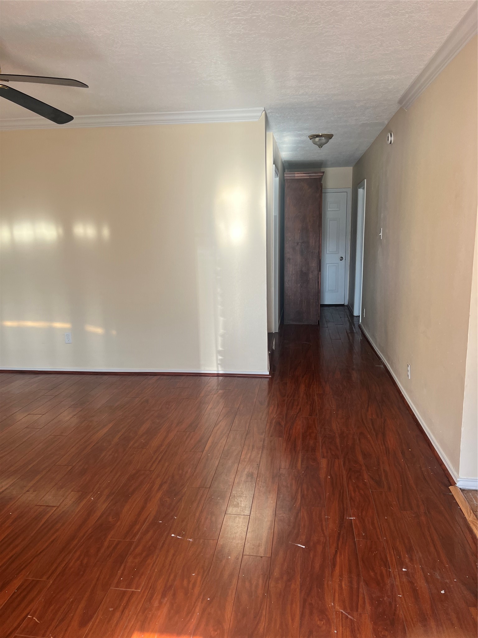 5604 Chapman Street Houston, TX 77009 - Photo 10 of 25 a view of an empty room with wooden floor and a window