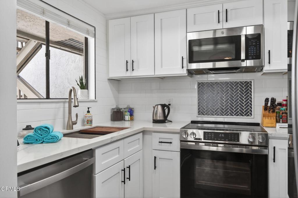 2955 Harbor Boulevard Oxnard, CA 93035 - Photo 2 of 41 a kitchen with appliances a sink and cabinets