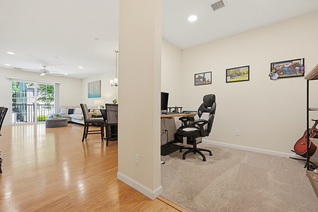200 Revere Street, Unit 4209 Canton, MA 02021 - Photo 5 of 35 a view of a livingroom with workspace and a couch