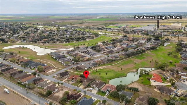 an aerial view of a house with a swimming pool