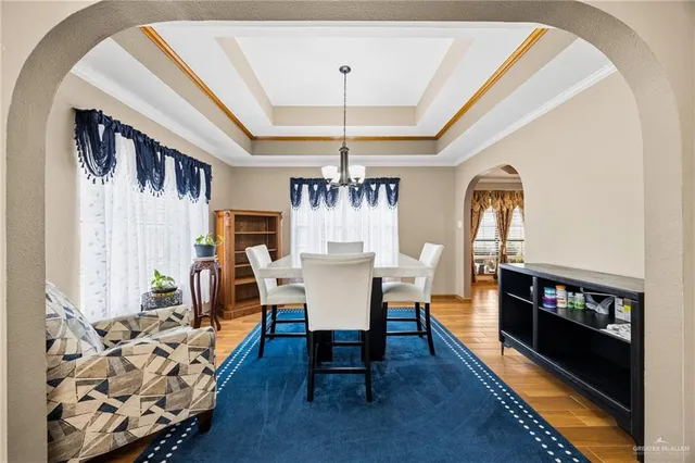 a view of a dining room with furniture and wooden floor