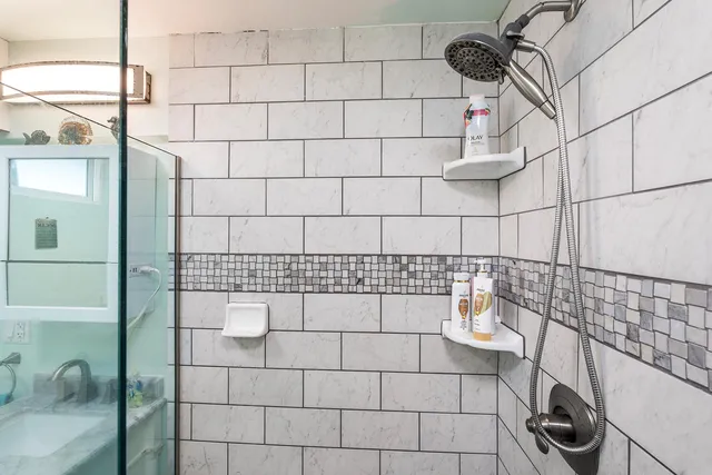 a bathroom with a sink and a shower