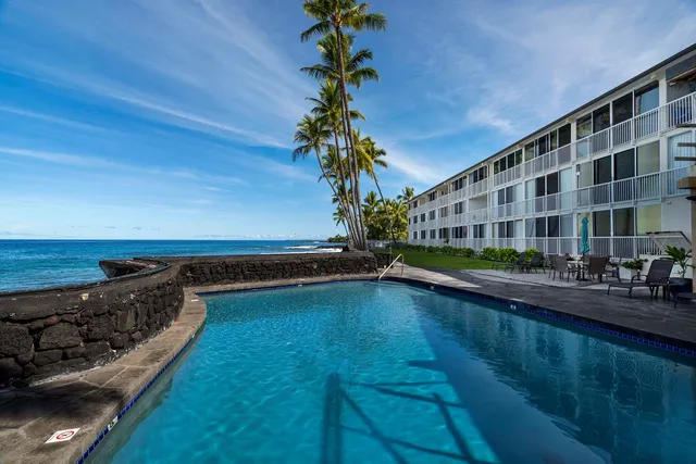 a view of swimming pool from a balcony