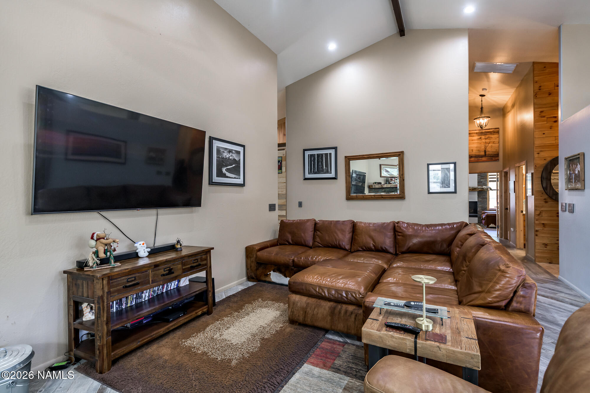7042 East Robin Hood Road Williams, AZ 86046 - Photo 11 of 58 a living room with furniture and a flat screen tv