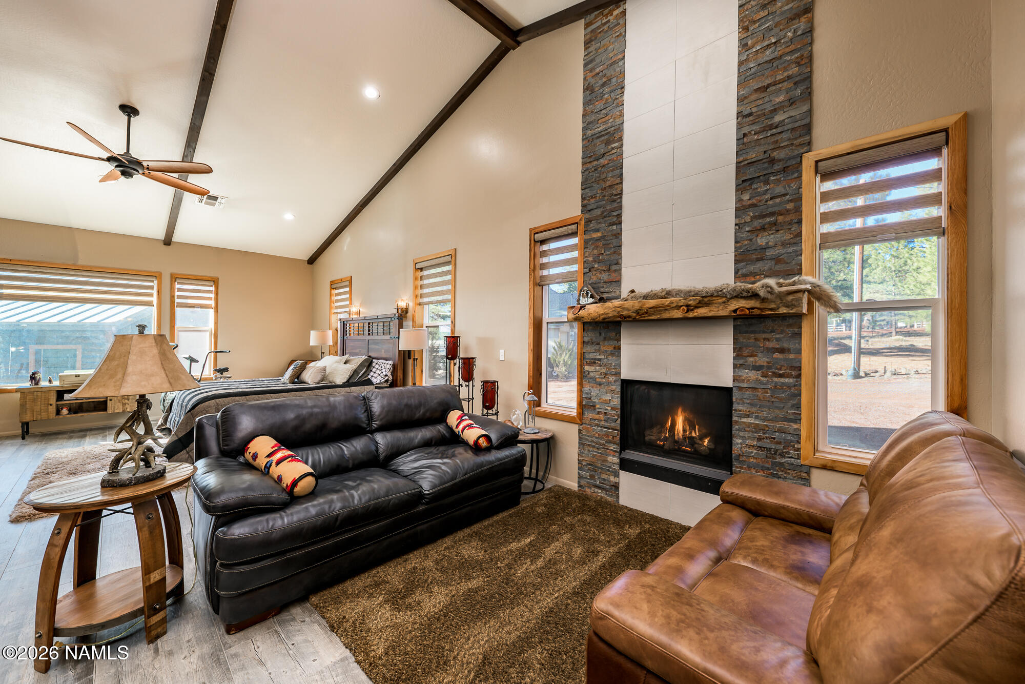 7042 East Robin Hood Road Williams, AZ 86046 - Photo 12 of 58 a living room with furniture and a fireplace