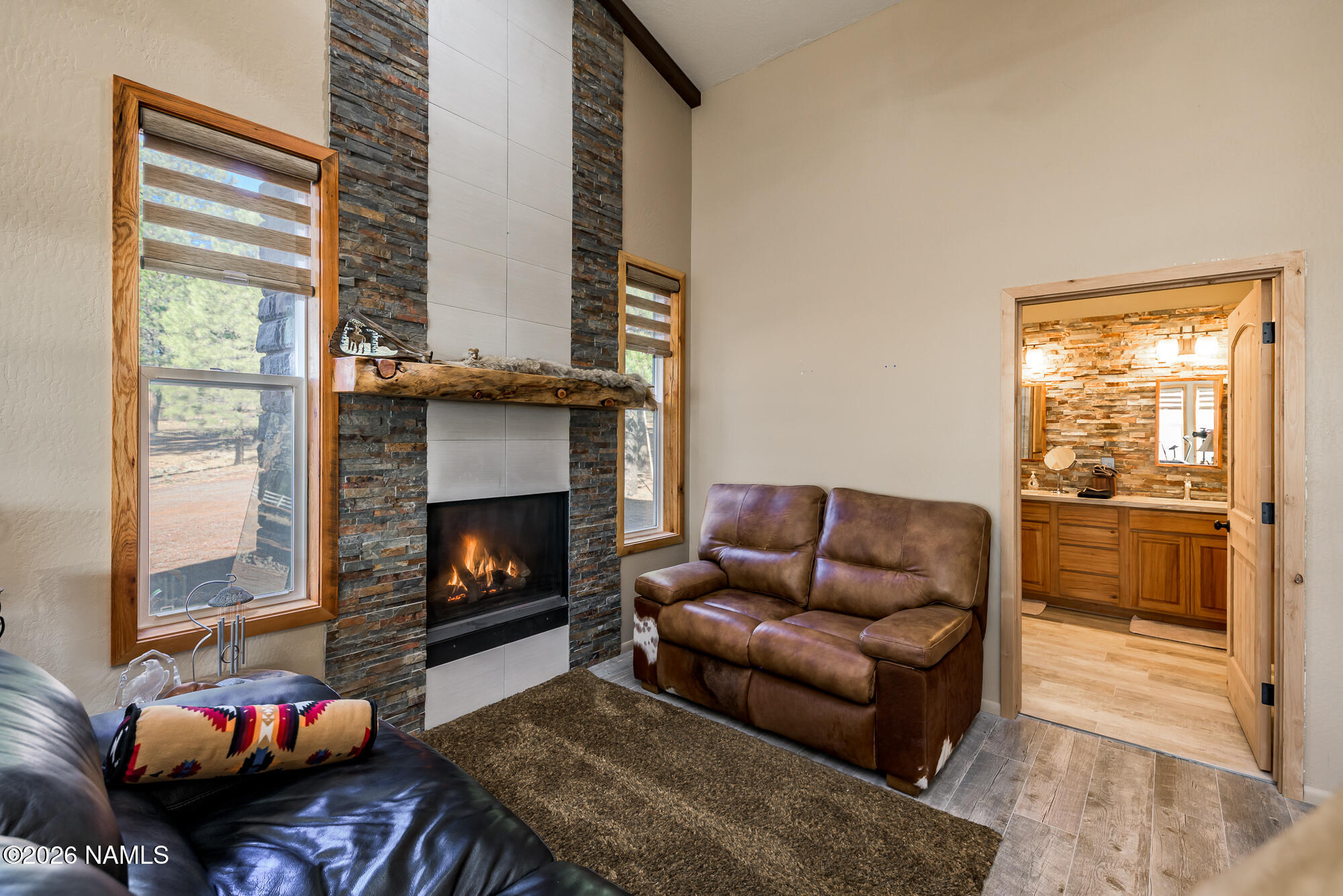 7042 East Robin Hood Road Williams, AZ 86046 - Photo 14 of 58 a living room with furniture and a fireplace