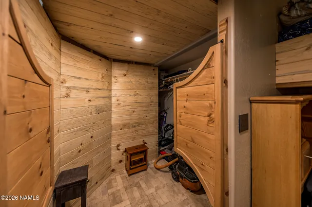 a bath tub sitting in a bathroom next to a window