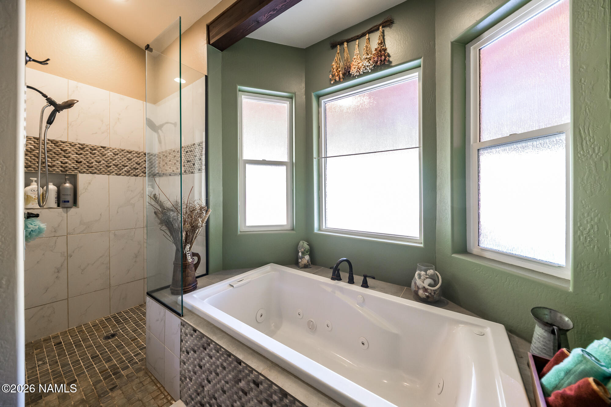 7042 East Robin Hood Road Williams, AZ 86046 - Photo 22 of 58 a bath tub sitting in a bathroom next to a window