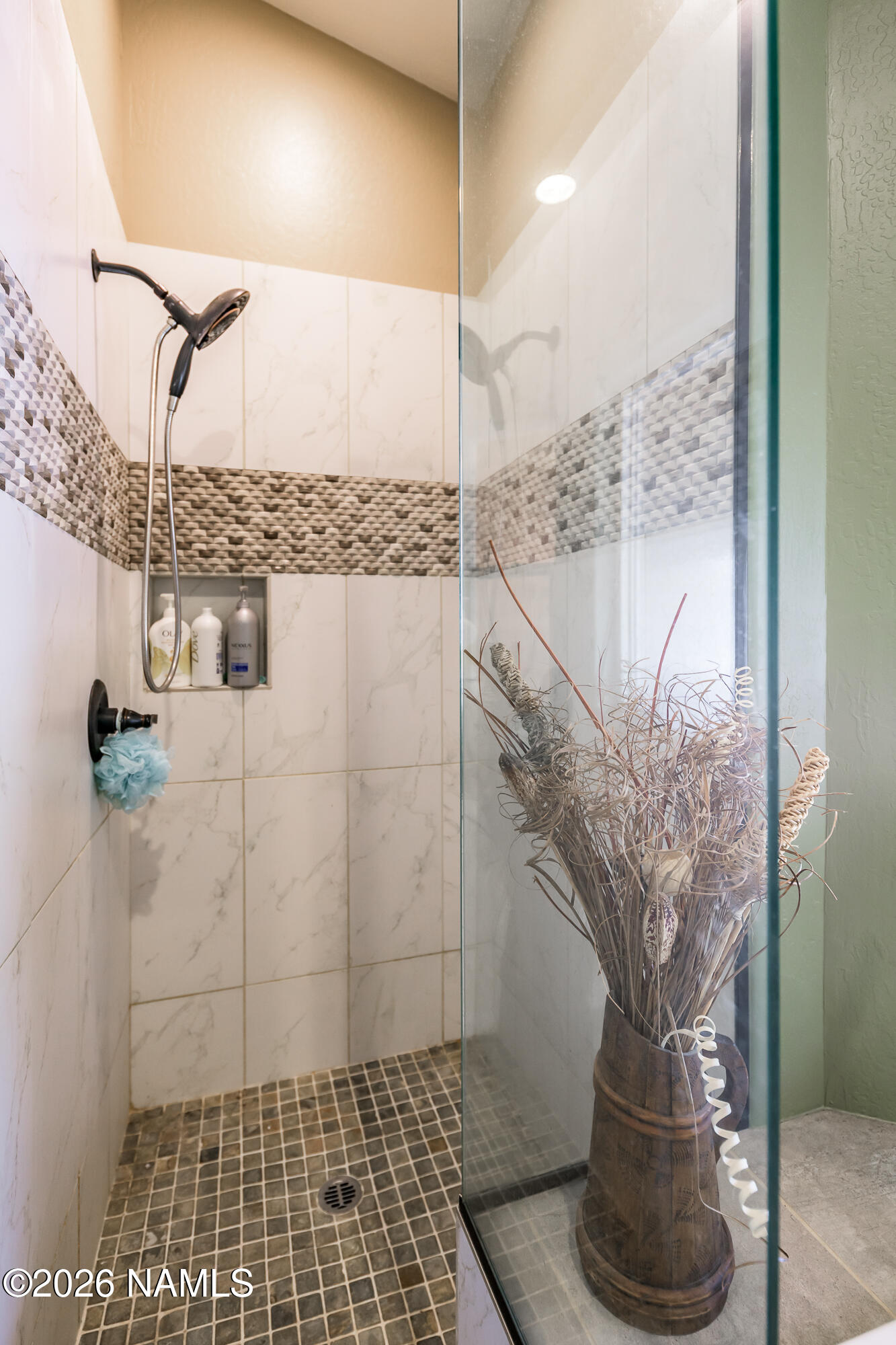 7042 East Robin Hood Road Williams, AZ 86046 - Photo 23 of 58 a vase of flowers sitting on a counter