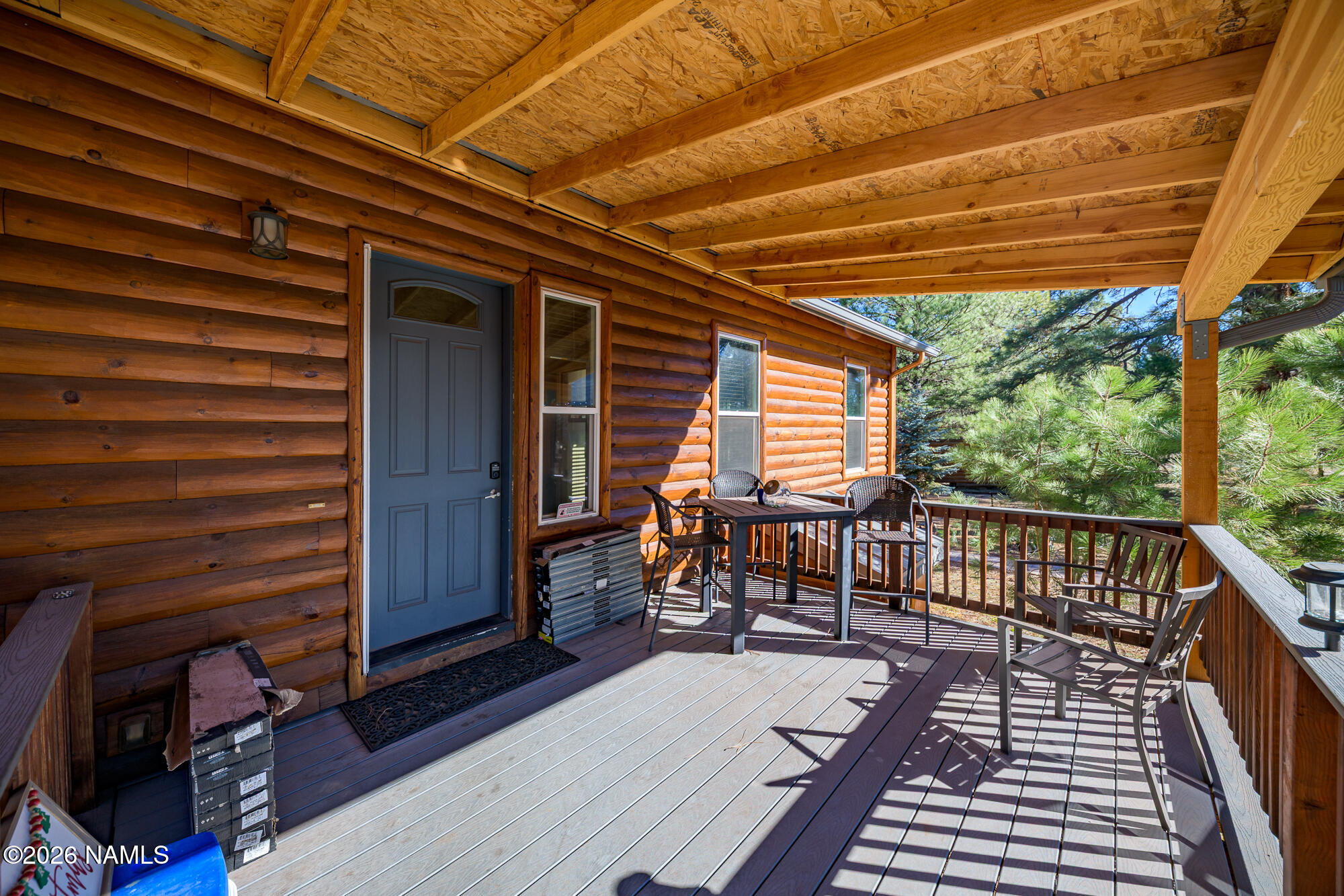 7042 East Robin Hood Road Williams, AZ 86046 - Photo 31 of 58 a balcony with furniture and a potted plant