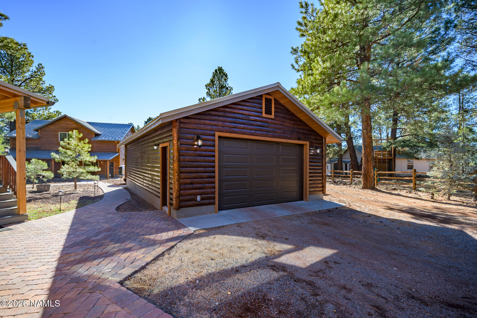 7042 East Robin Hood Road Williams, AZ 86046 - Photo 32 of 58 a view of a house with a yard