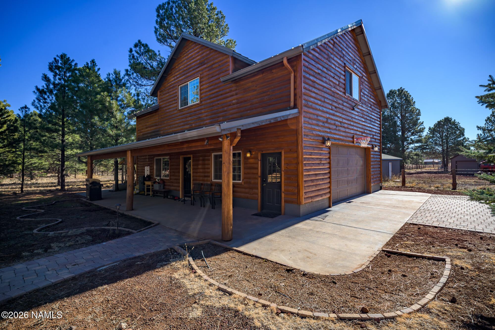 7042 East Robin Hood Road Williams, AZ 86046 - Photo 34 of 58 a view of a house with a yard