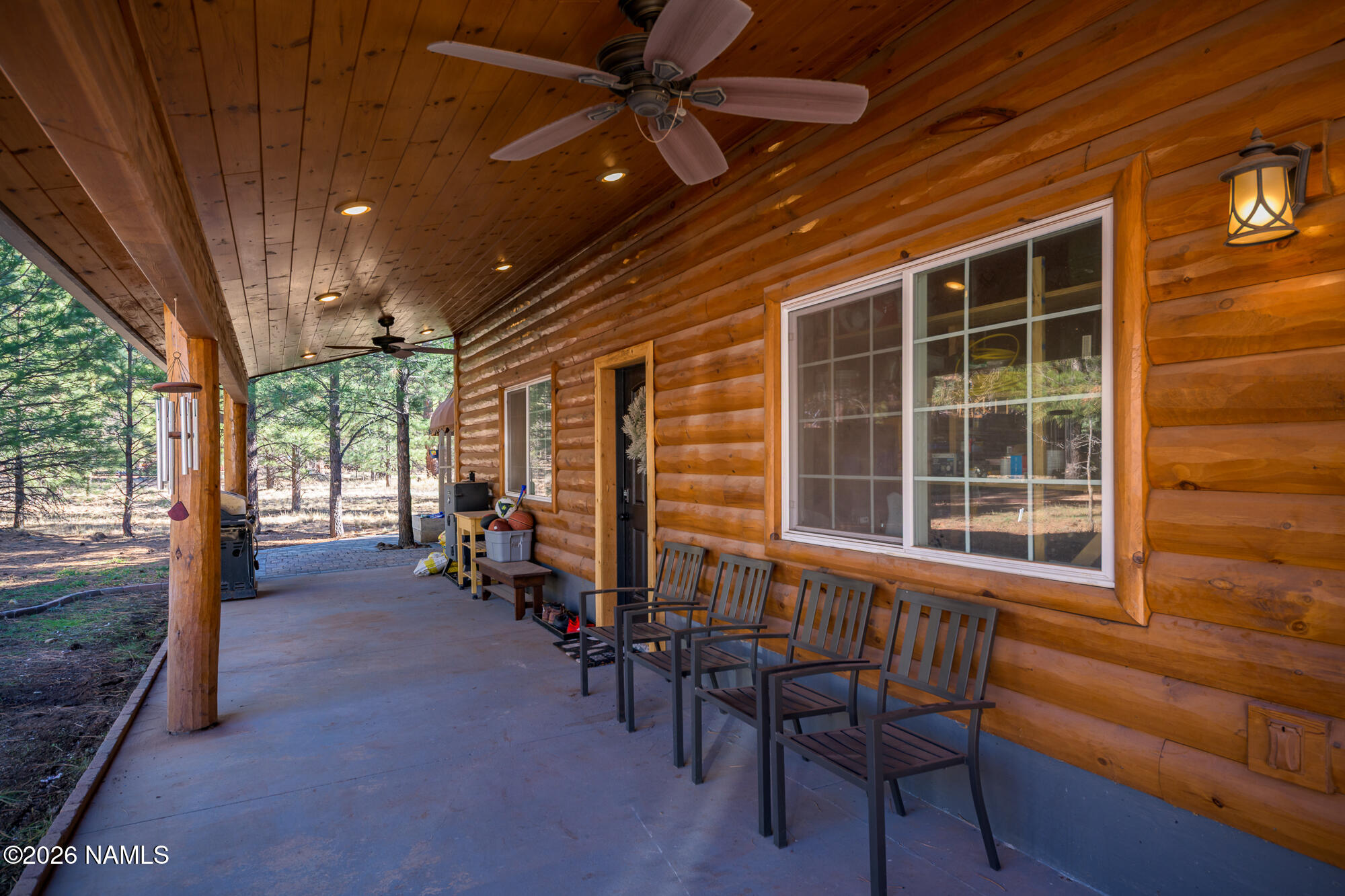 7042 East Robin Hood Road Williams, AZ 86046 - Photo 35 of 58 a view of a livingroom with furniture and floor to ceiling window