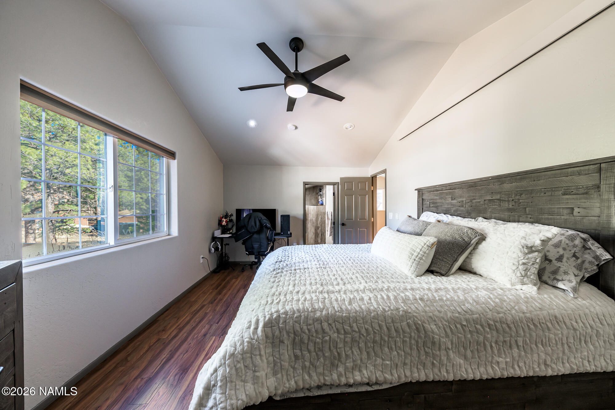 7042 East Robin Hood Road Williams, AZ 86046 - Photo 41 of 58 a bedroom with a bed and window