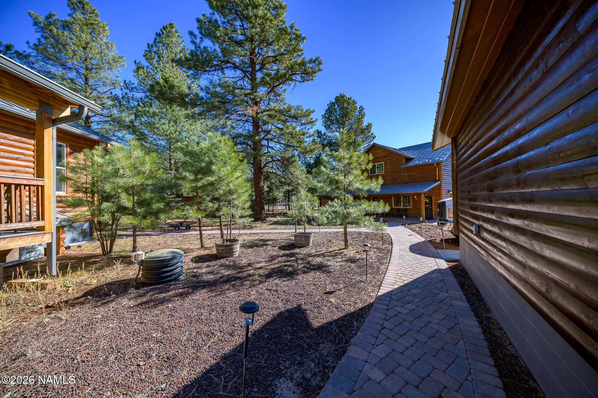 7042 East Robin Hood Road Williams, AZ 86046 - Photo 54 of 58 a view of a backyard with sitting area