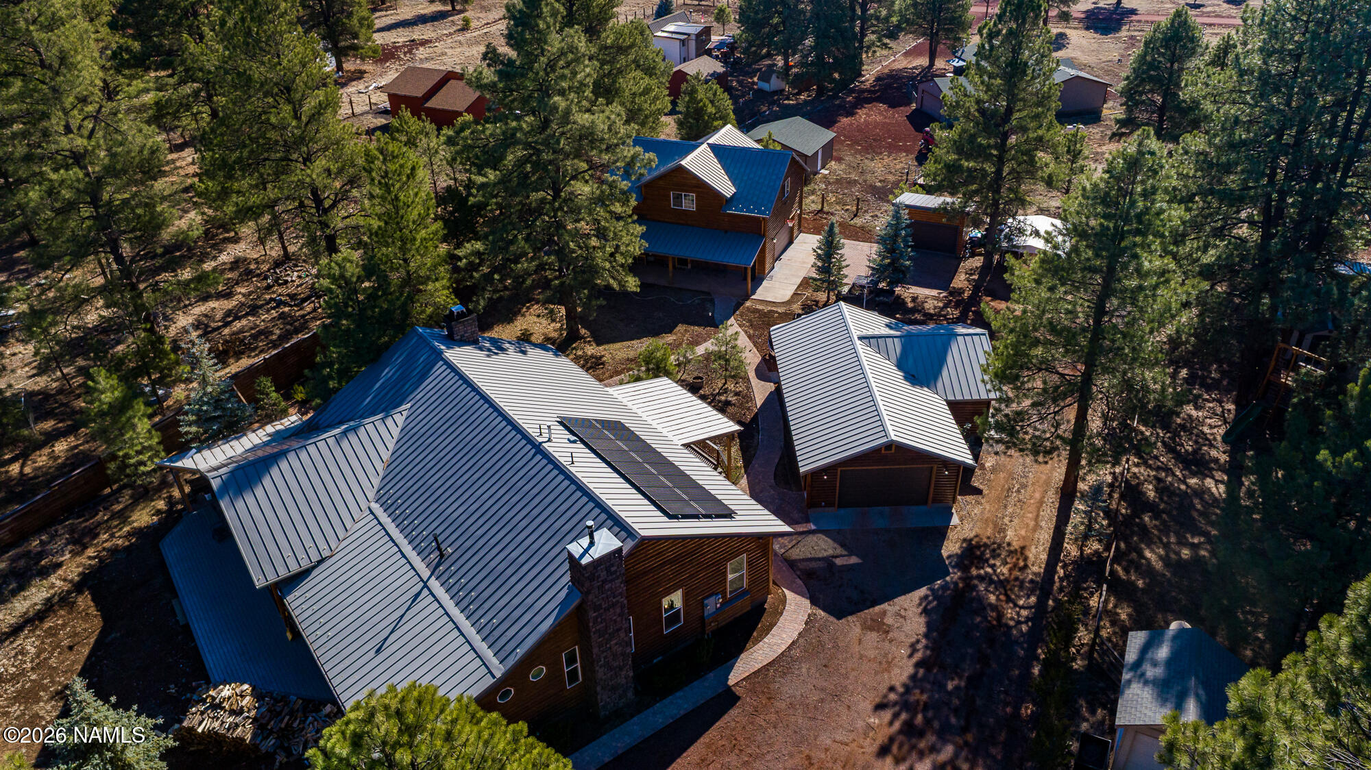 7042 East Robin Hood Road Williams, AZ 86046 - Photo 57 of 58 an aerial view of a house with a yard