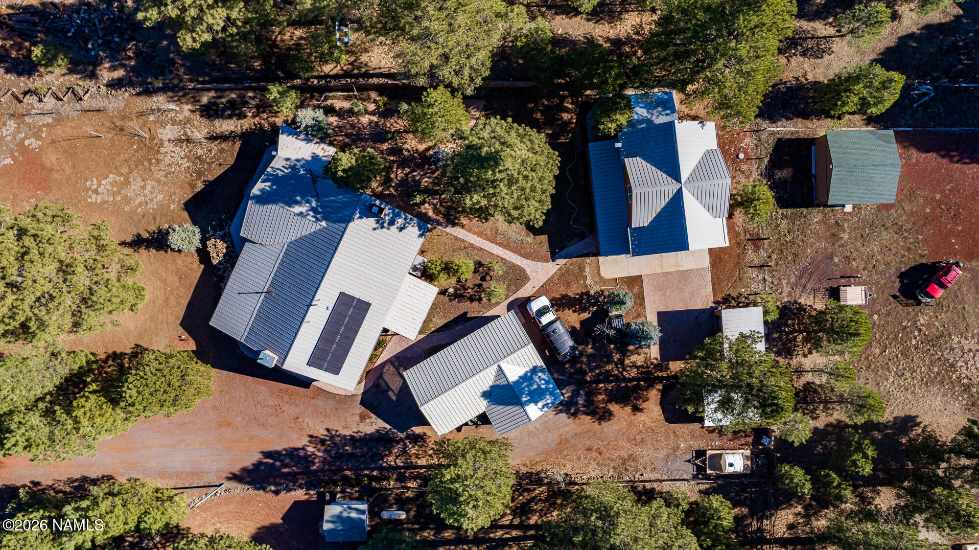 7042 East Robin Hood Road Williams, AZ 86046 - Photo 58 of 58 an aerial view of multiple houses with yard