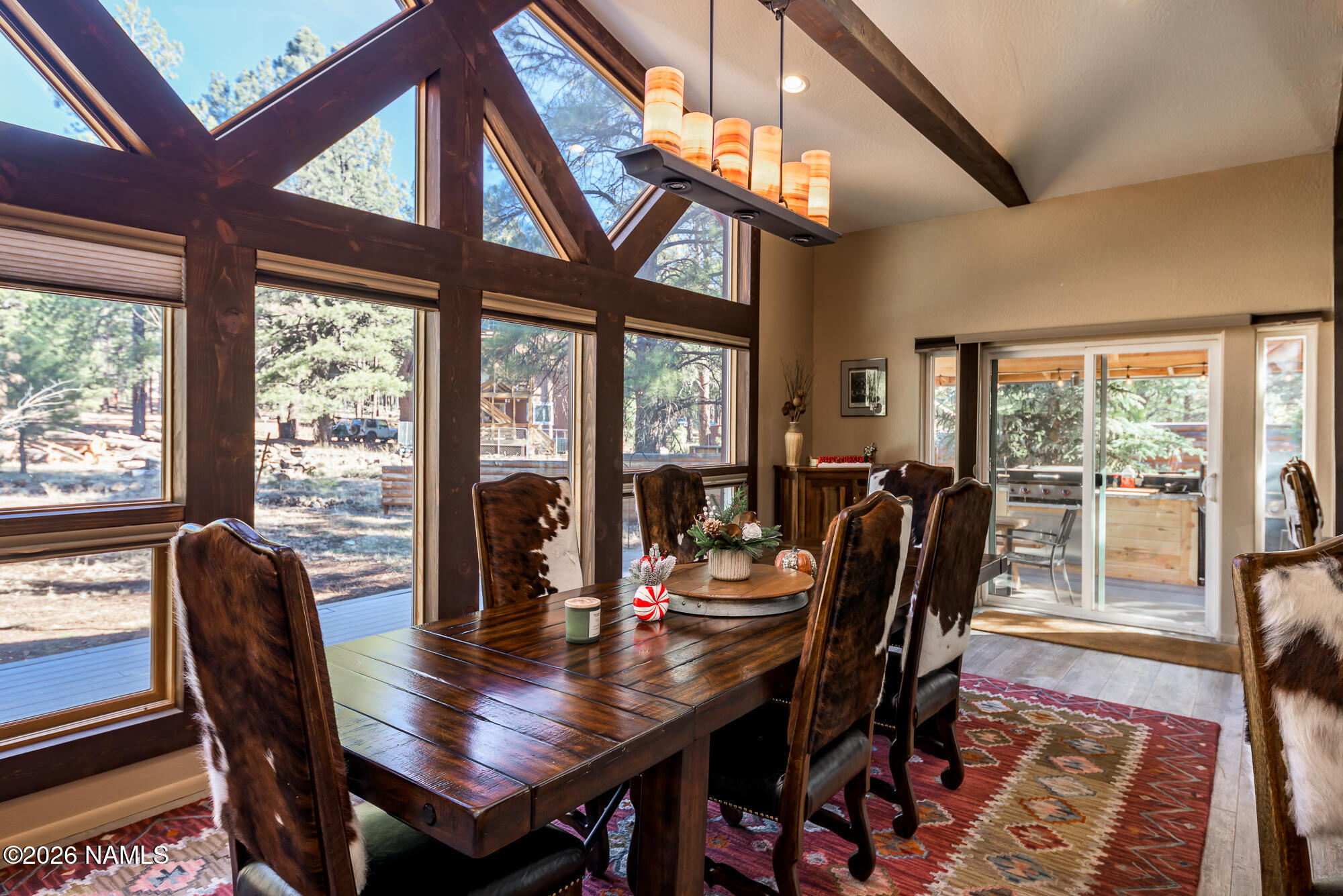7042 East Robin Hood Road Williams, AZ 86046 - Photo 9 of 58 a view of a dining room with furniture window and outside view