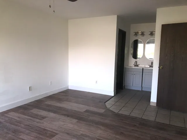 a bathroom with a shower and toilet