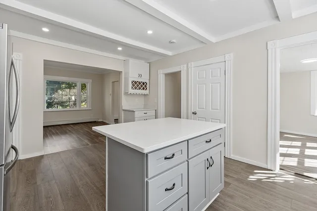 a view of a center island wooden floor