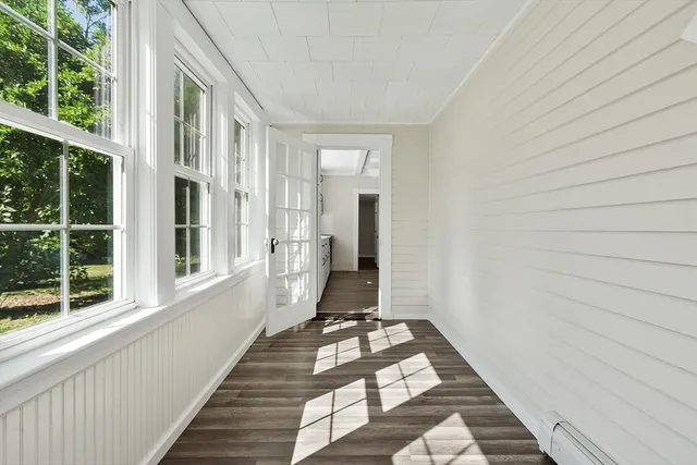 a view of a balcony with wooden floor