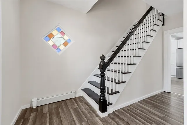 a view of entryway with wooden floor