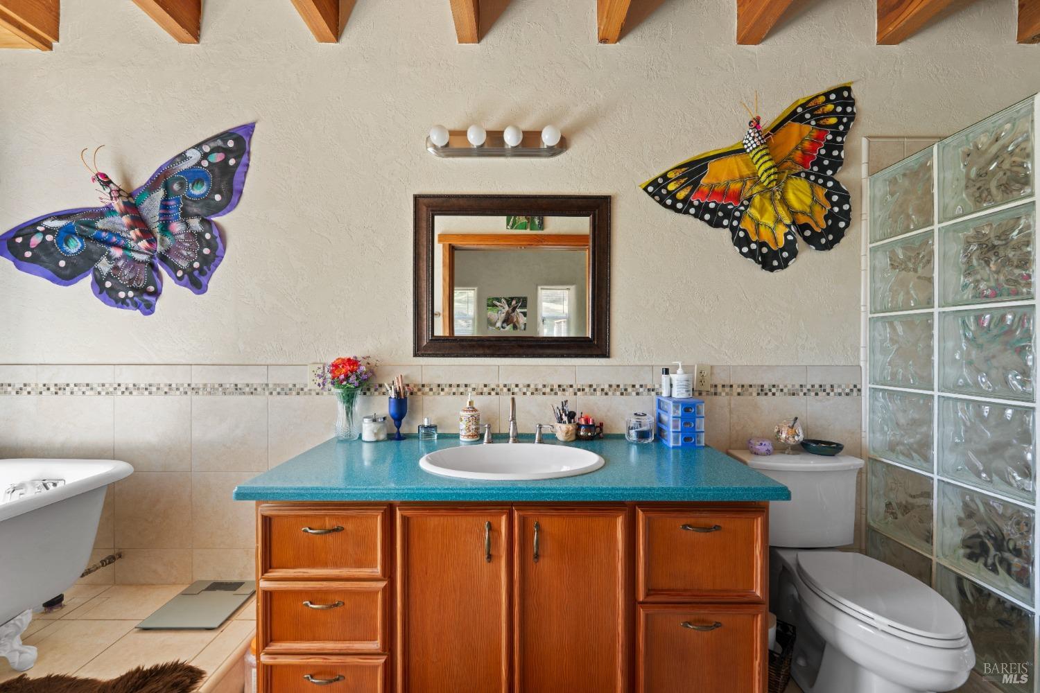 9655 Peachland Road Boonville, CA 95415 - Photo 15 of 40 a bathroom with a sink mirror and toilet