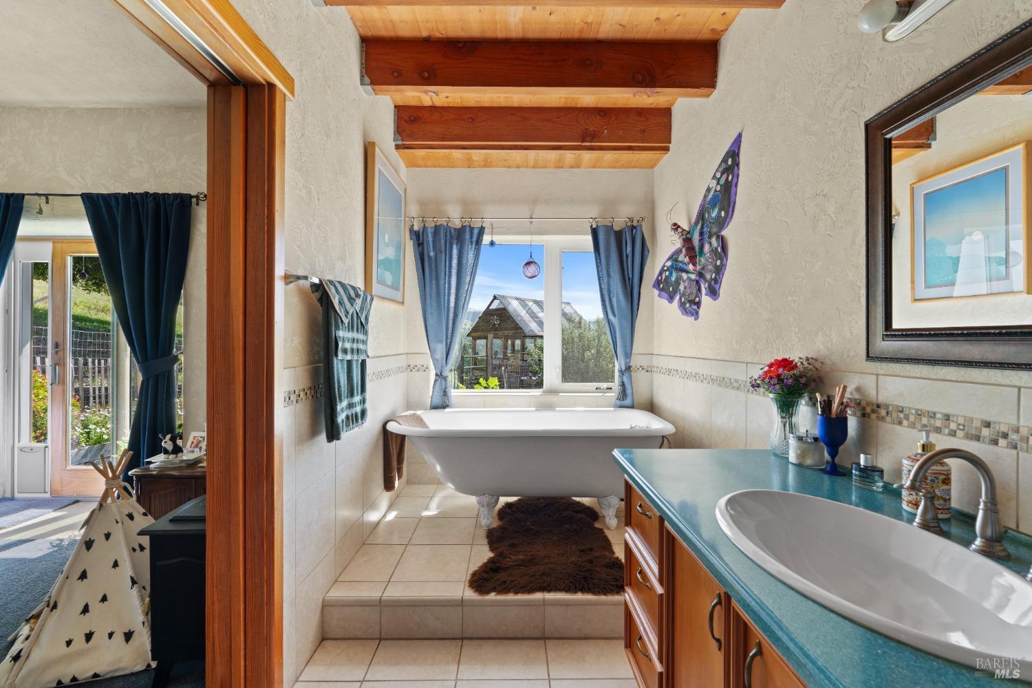 9655 Peachland Road Boonville, CA 95415 - Photo 16 of 40 a living room with furniture and a large window