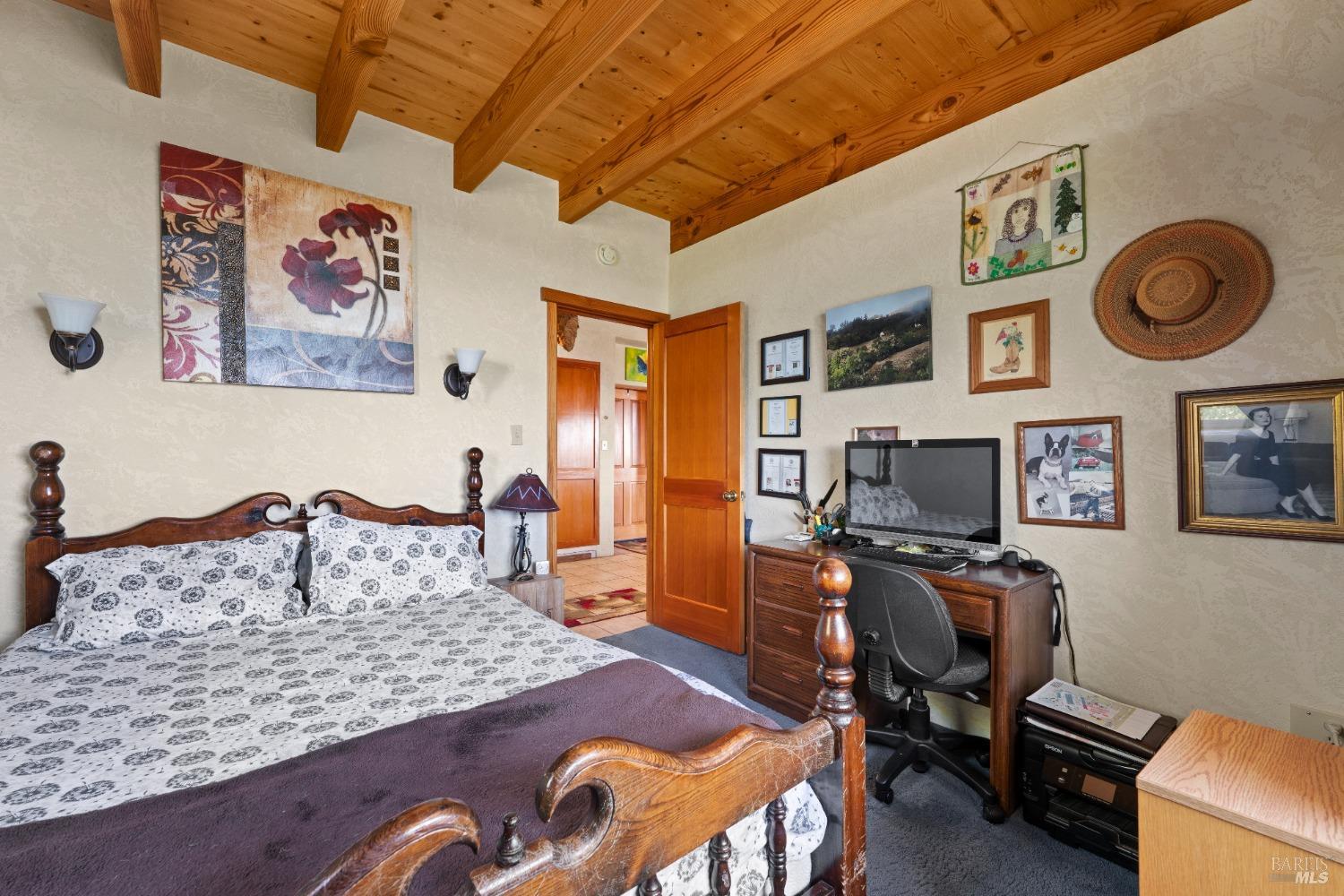 9655 Peachland Road Boonville, CA 95415 - Photo 19 of 40 a bedroom with a bed and cabinets