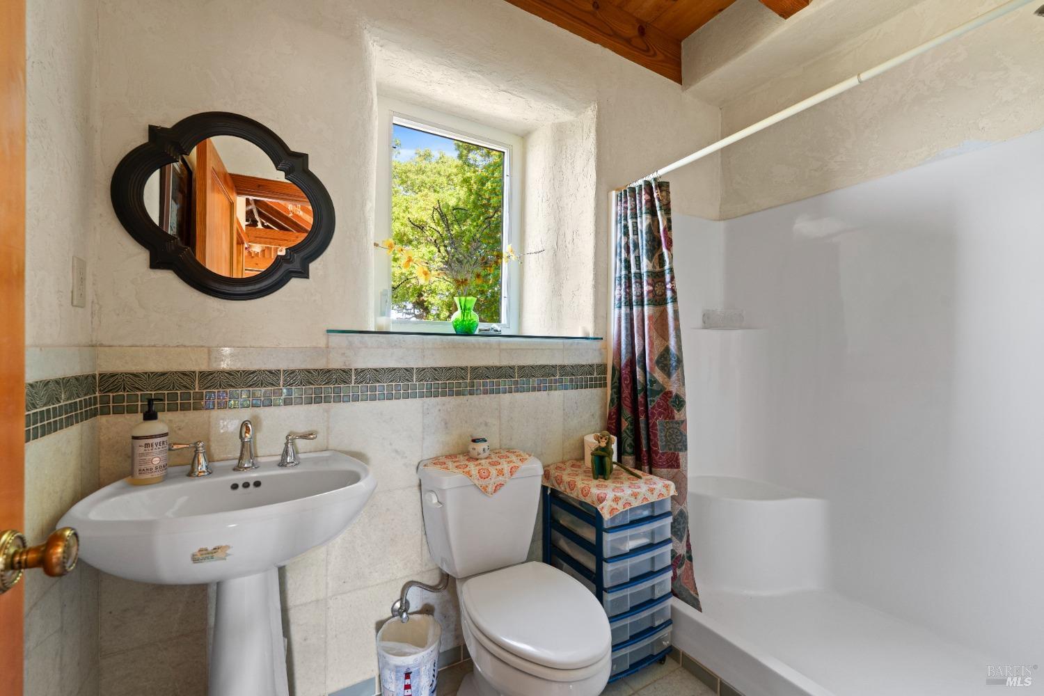 9655 Peachland Road Boonville, CA 95415 - Photo 20 of 40 a bathroom with a sink a toilet and a mirror