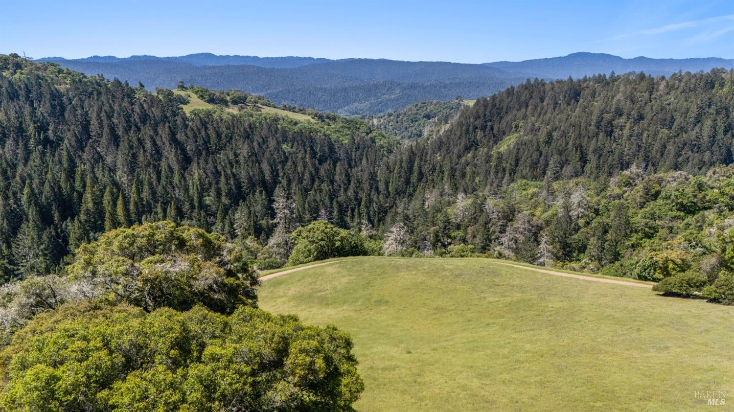 9655 Peachland Road Boonville, CA 95415 - Photo 2 of 40 a view of a lush green hillside and a houses