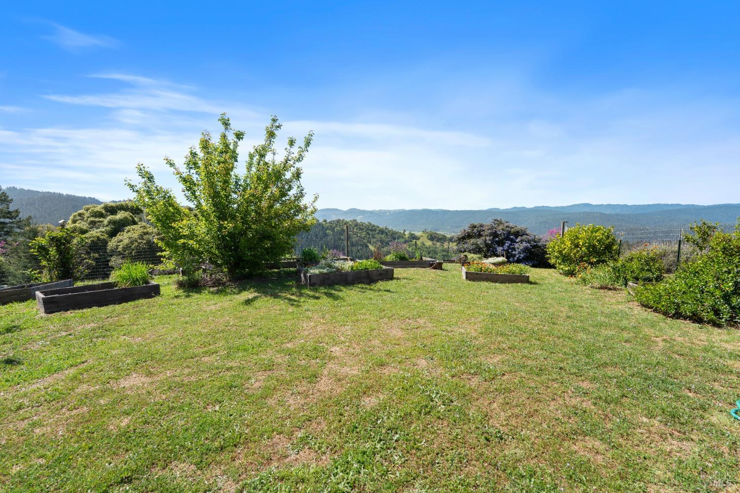 9655 Peachland Road Boonville, CA 95415 - Photo 25 of 40 a view of a lake with houses in the back