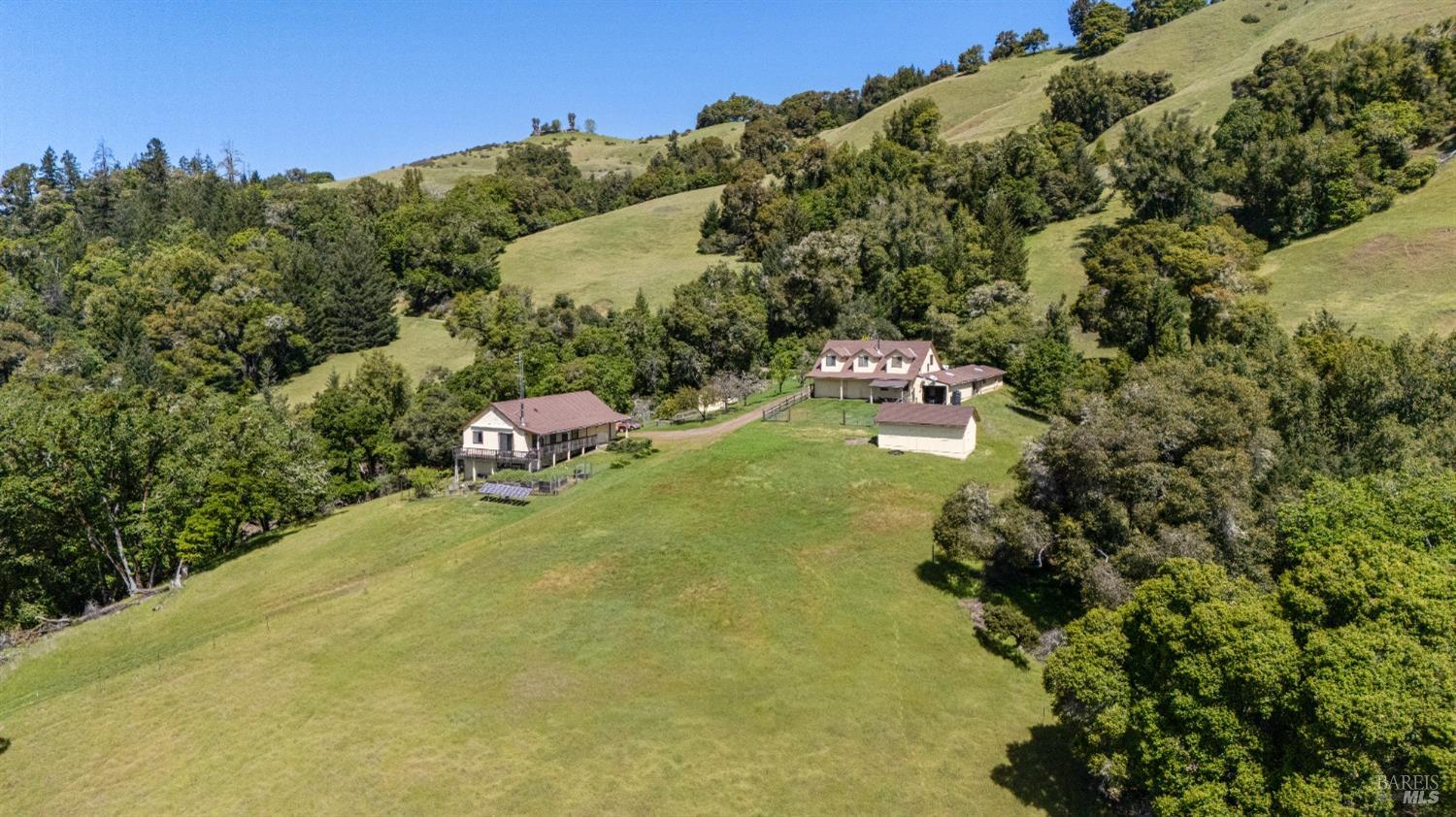 9655 Peachland Road Boonville, CA 95415 - Photo 30 of 40 a backyard of a house with a yard and outdoor seating