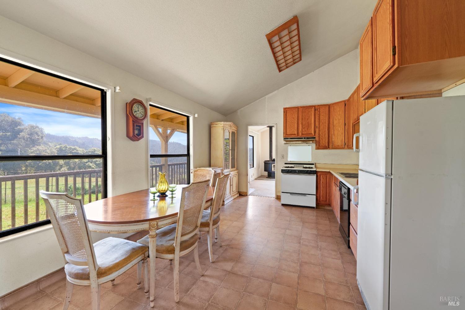 9655 Peachland Road Boonville, CA 95415 - Photo 31 of 40 a view of a dining room with furniture large window and outside view