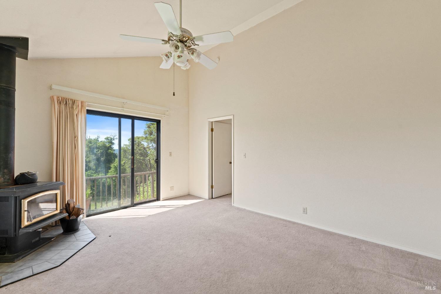 9655 Peachland Road Boonville, CA 95415 - Photo 32 of 40 a view of a livingroom with a ceiling fan and window