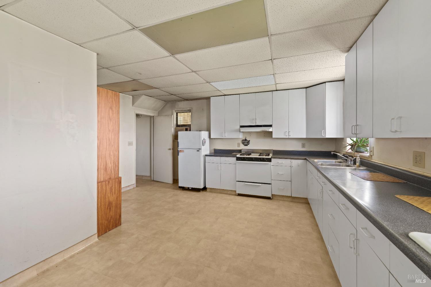 9655 Peachland Road Boonville, CA 95415 - Photo 35 of 40 a large kitchen with cabinets and stainless steel appliances