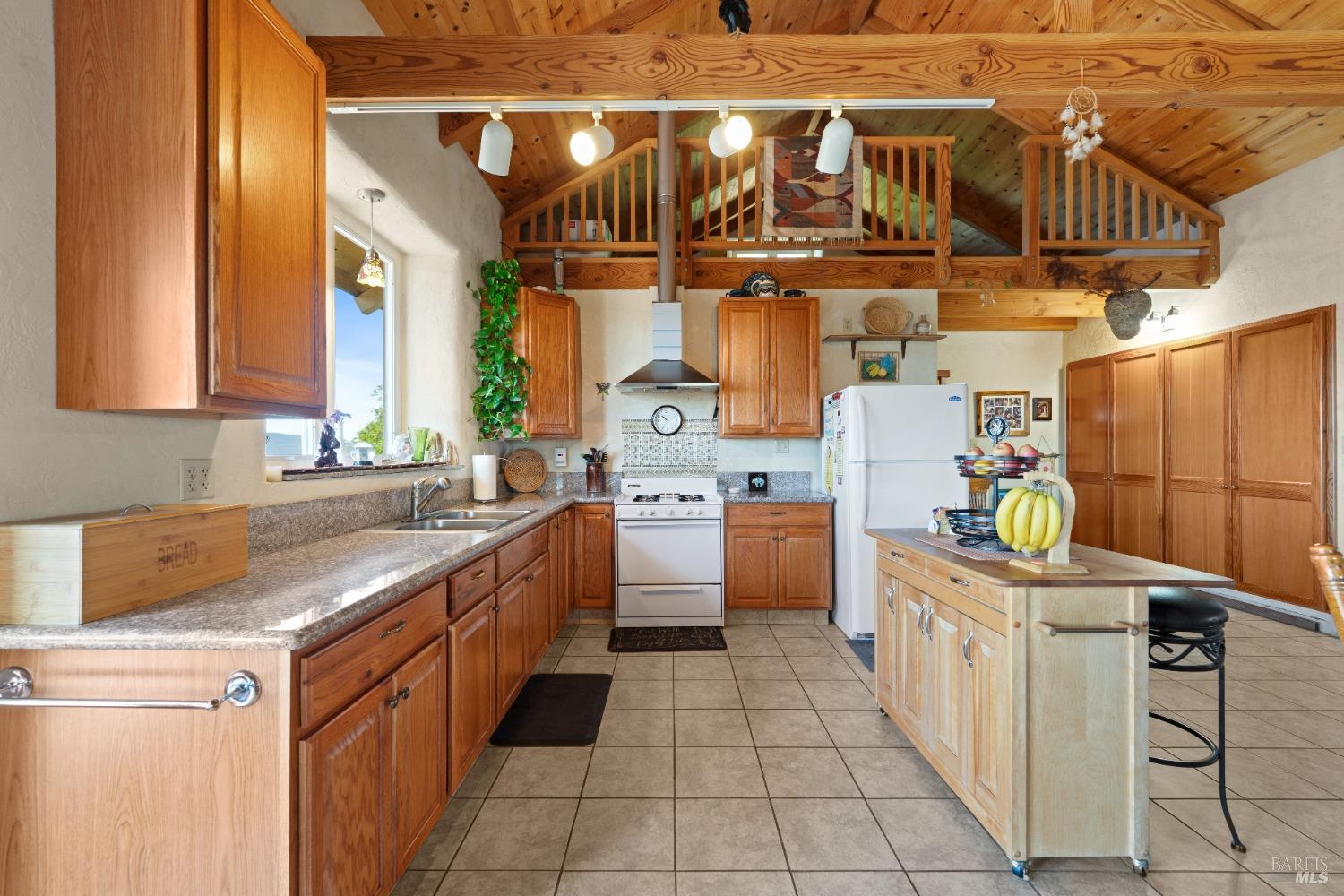 9655 Peachland Road Boonville, CA 95415 - Photo 8 of 40 a kitchen with stainless steel appliances granite countertop a sink stove and cabinets