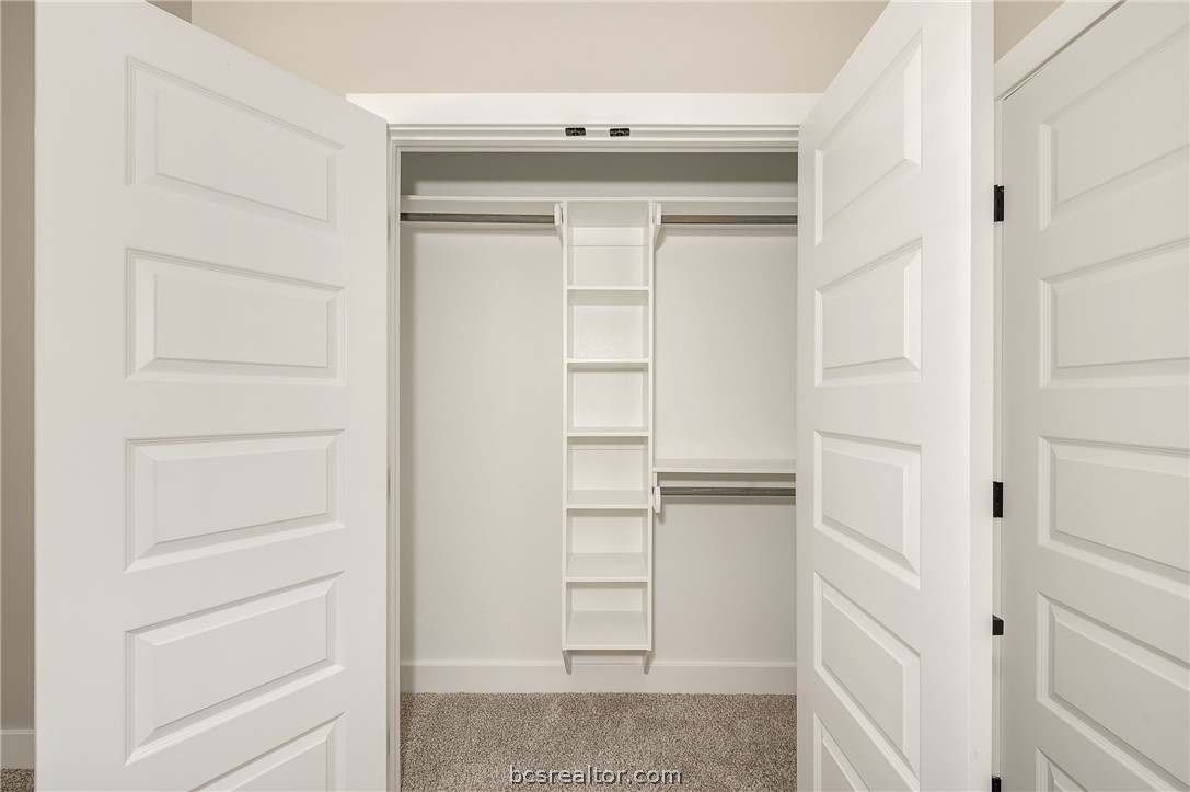 2908 GOLDBERG Drive Bryan, TX 77808 - Photo 15 of 44 Closet features rod and shelve and cubbies for storage.