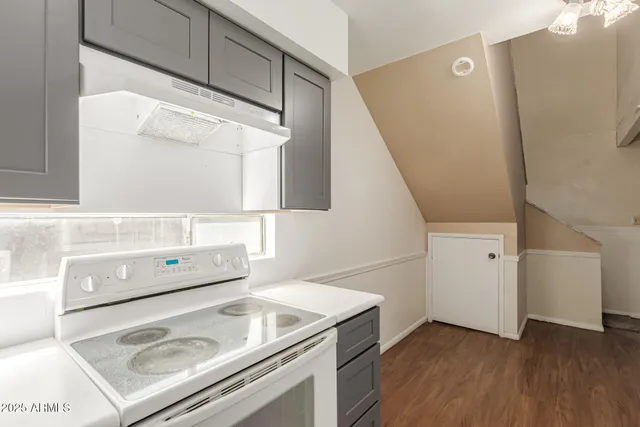 a white refrigerator freezer sitting inside of a kitchen