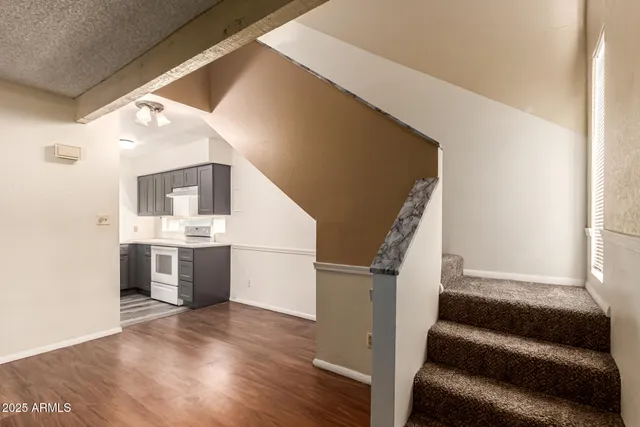a view of kitchen and utility room with wooden floor