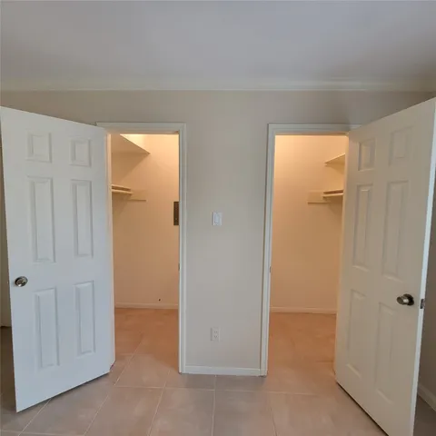 a view of a hallway with closet area